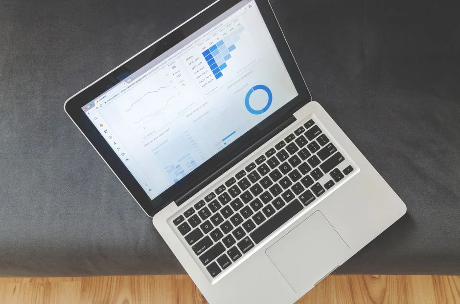 A top view on charts and smartphone in an office, showcasing data analytics.