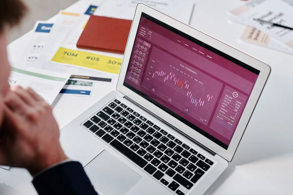 Close-up of a woman working on a digital marketing project in a home office setting.